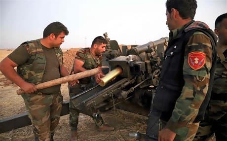 Peshmerga fighters load an artillery at the Altun Kubri checkpoint, 40 km from Kirkuk, on October 20, 2017. Photo: Marc-Antoine Pelaez | AFP
