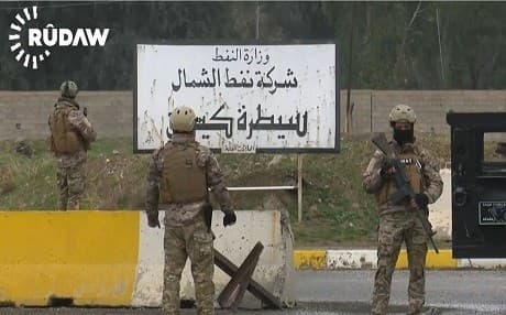 Members of the security forces of the Patriotic Union of Kurdistan guard the main gate of the Iraqi North Oil Company in March 2017. Photo: Rudaw video