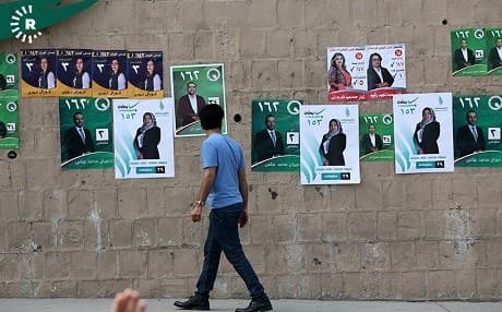 A man walks past election posters in Sulaimani. Photo: Sartip Othman/Rudaw