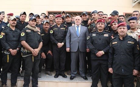Questioning of at least one ISIS suspect was done under the ‘direct supervision’ of Prime Minister Abadi, pictured here posing with security force personnel while on the campaign trail in Kirkuk. Photo: Haider al-Abadi/Twitter