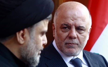 Iraqi Prime Minister Haider al-Abadi (R) pictured with cleric Moqtada al-Sadr in Najaf in 2015. File photo: Haidar Hamdani/AFP