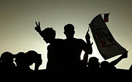 Supporters the Popular Mobilization Forces political block attend a campaign rally in Iraq. File photo: Hadi Mizban | AP