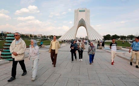Tourists visit Tehran's Azadi Tower. Photo: Atta Kenare/AFP