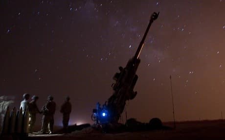 Coalition forces wait near their M777 Howitzer as they provide support for the SDF during Operation Roundup near Dashisha on June 8. Photo: Staff Sgt. Timothy R. Koster/US Army