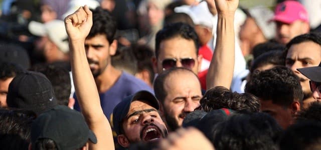 Protesters shout during a demonstration outside local government headquarters in Basra on Friday. Photo: Haidar Mohammed Ali/AFP