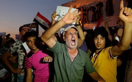 Protesters take to the streets to demand basic services and jobs in Basra, Iraq, in early-July 2018. Photo: Hadi Mizban | AP