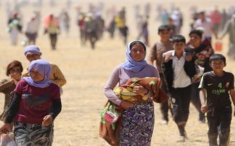 Thousands of Yezidis were trapped on Mount Shingal after ISIS captured the town in August 2014. AP file photo.