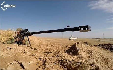 A member of the KRG's Rojava Peshmerga takes aim with his long-range weapon near Shingal. Photo: Rudaw video