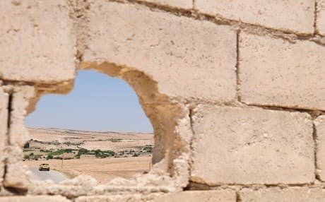 Turkish forces are seen in the distance during an independent, coordinated patrol by US forces outside Manbij, Syria, on July 22, 2018. Photo: Sgt. Nicole Paese | U.S. Army