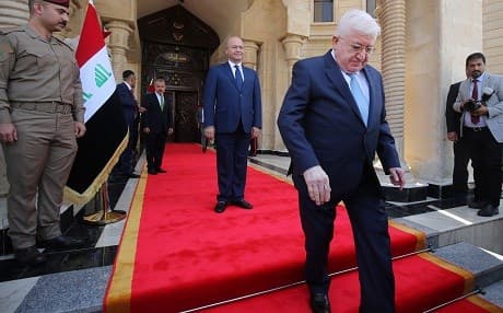 Newly elected President of Iraq Barham Salih watches as his predecessor Fuad Masum leaves during a handing-over ceremony in Baghdad on Wednesday. Photo: Sabah Arar/AFP