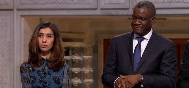 Members of the Norwegian Nobel Peace Prize committee award laureates Yezidi activist Nadia Murad and Congolese doctor Denis Mukwege on December 9, 2018. File photo: AP video