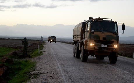Turkish military trucks are pictured transporting equipment to the border with Syria in Kilis on December 12, 2018. Photos: Ahmed Ekinci/Anadolu Agency