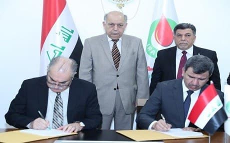 Iraqi Oil Minister Thamir Ghadhban oversaw signing of two contracts to further develop Basra’s Majnoon oilfield. Photo: Oil Ministry