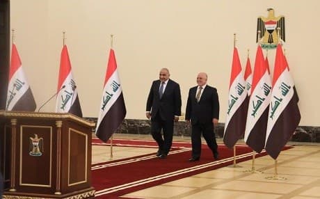 Iraqi Prime Minister Adil Abdul-Mahdi (L) and his predecessor Haider al-Abadi in happier times, handing over power. File Photo: PM office