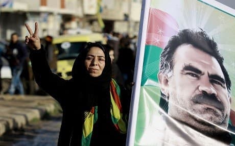 A Syrian Kurdish woman holds a portrait of jailed Kurdish leader Abdullah Ocalan during a rally in Qamishli, northern Syria, January 2017. File photo: AFP