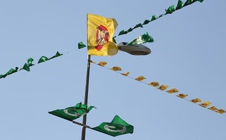Rival KDP and PUK flags blow in the wind during an election campaign. File photo: Rudaw