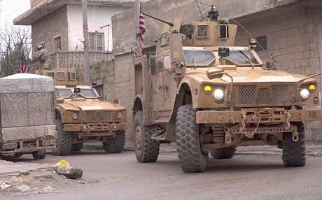 US armoured vehicles are at the scene of a suicide attack that killed four US personnel in Manbij on January 16, 2019. Photo: image grab/AFP