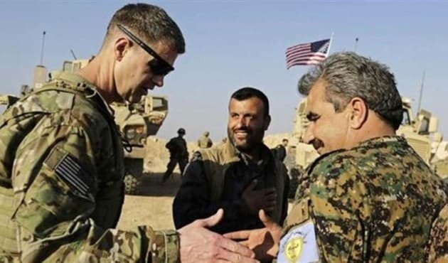 Shervan Derwish (right) meets with US Army Maj. Gen. James B. Jarrard, commander of Special Operations Joint Task Force Operation Inherent Resolve, in northern Syria. File photo: AP