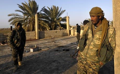 SDF fighters pictured in Baghouz village on January 26, 2019. Photo: Delil Souleiman/AFP
