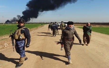Volunteer and uniformed Peshmerga fighters advance on ISIS positions in northern Iraq on October 23, 2015. File Photo: Marwan Ibrahim | AFP
