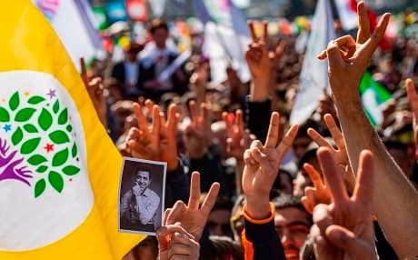 Supporters of Turkey's Peoples' Democratic Party (HDP) cheer and hold up a photo of Selahattin Demirtas as they celebrate Newroz during a campaign rally in Istanbul on March 24, 2019 ahead of the March 31 local elections. Photo: Yasin Akgul/AFP