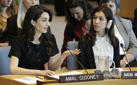 While Nadia Murad Basee Taha, right, listens, Amal Clooney speaks during a Security Council meeting on sexual violence at United Nations headquarters, April 23, 2019. Photo: Seth Wenig / AP