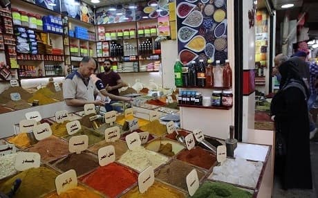 Iraqis shop food products ahead of the Muslim fasting month of Ramadan at the Sadriya market in the capital Baghdad on May 5, 2019. Photo: Sabah Arar | AFP