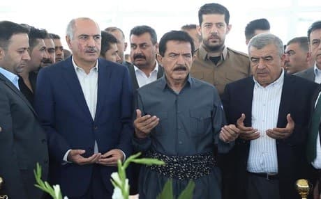 PUK acting leader Kosrat Rasul (center) prays at the gravesite of late party co-founder and leader Jalal Talabani in Sulaimani on the party's 44th anniversary on June 1, 2019. Photo: Rasul FB
