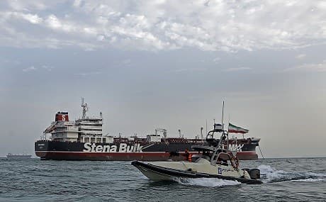 IRGC boats patrol around the British-flagged tanker Stena Impero anchored off the Iranian port city of Bandar Abbas, July 21, 2019. Hasan Shirvani / Mizan news agency / AFP
