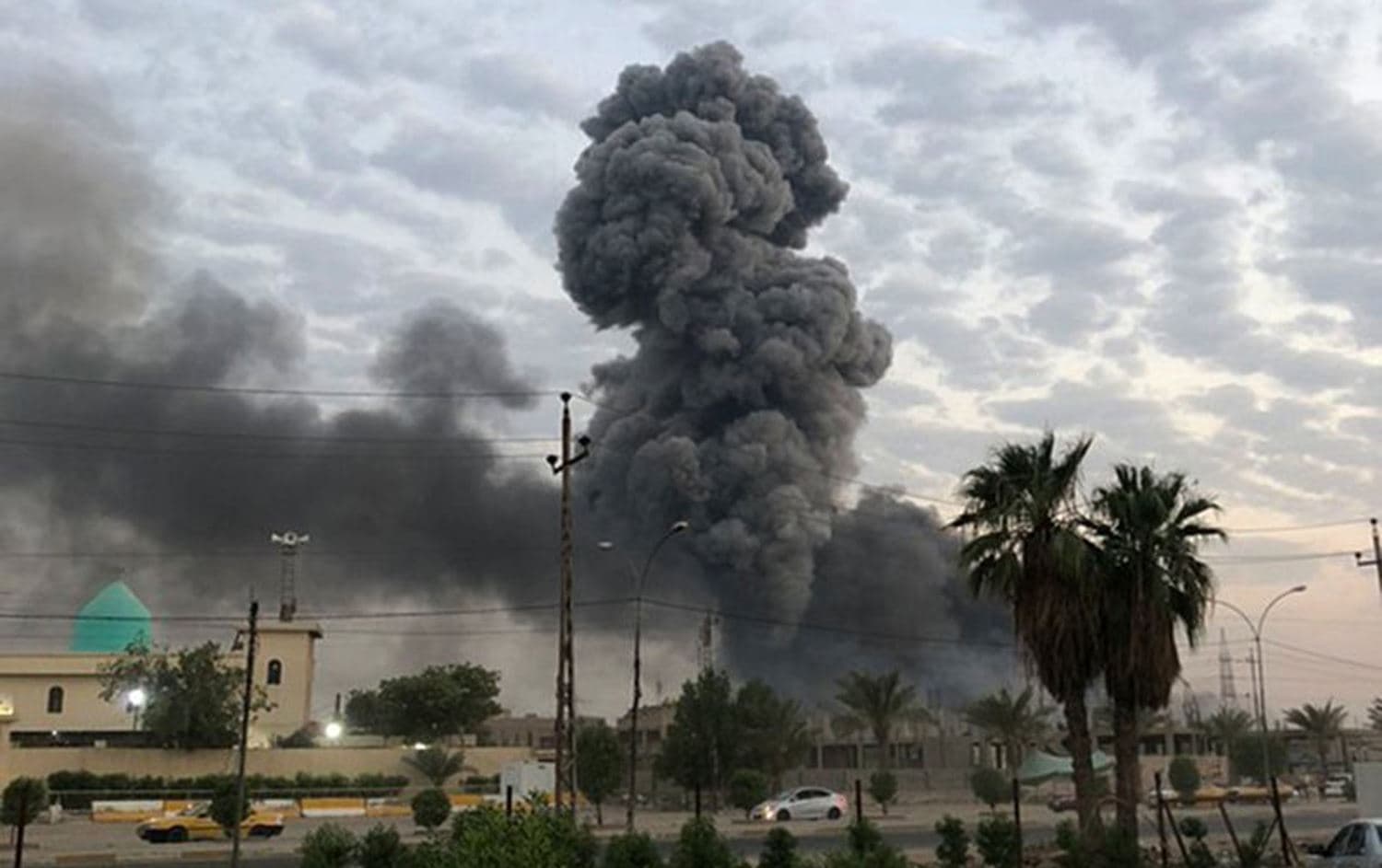 Plumes of smoke rise after an explosion at a military base southwest of Baghdad, Iraq, August 12, 2019. File photo: Loay Hameed / AP