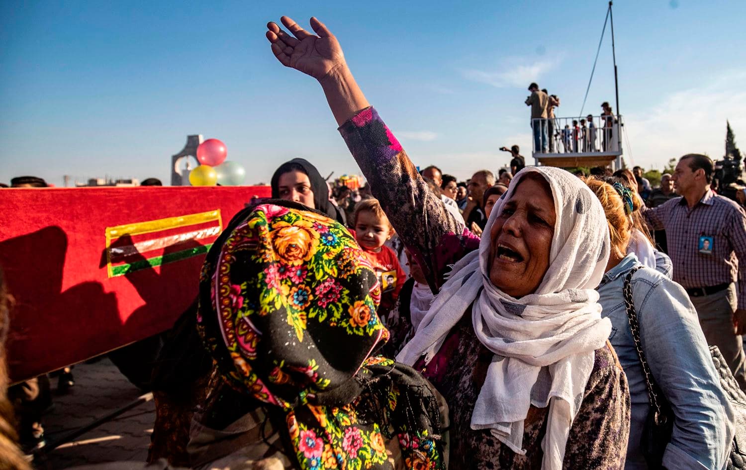 Mourners attend the funeral of five Syrian Democratic Forces' fighters killed in battles against Turkey-led forces in the flashpoint town of Sari Kani (Ras al-Ain) along the border, on October 14, 2019 in the Syrian Kurdish town of Qamishli. Photo: Delil Souleiman/AFP