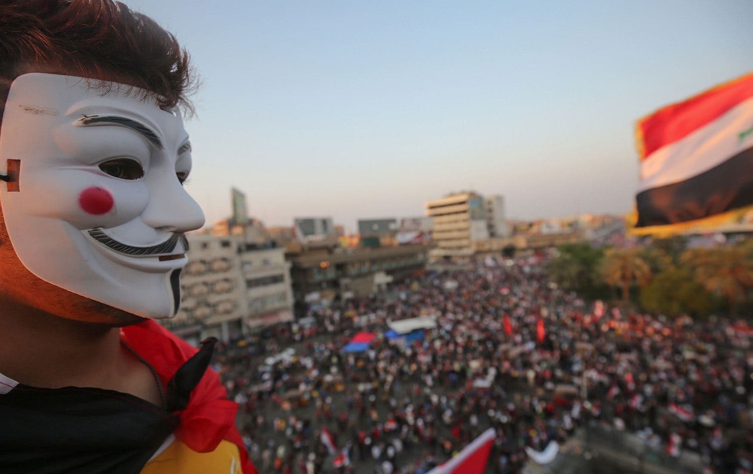 An Iraqi protester, wearing a Guy Fawkes mask, takes part in an anti-government demonstration at Tahrir Square, Baghdad, October 31, 2019. Photo: Ahmad al-Rubaye / AFP