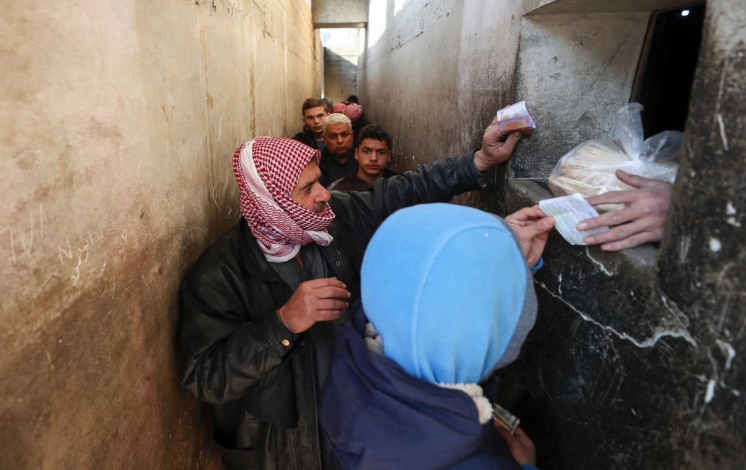 Syrians queue to buy bread in Binnish, Idlib province on January 11, 2020. Photo: Omar Haj Kadour/AFP