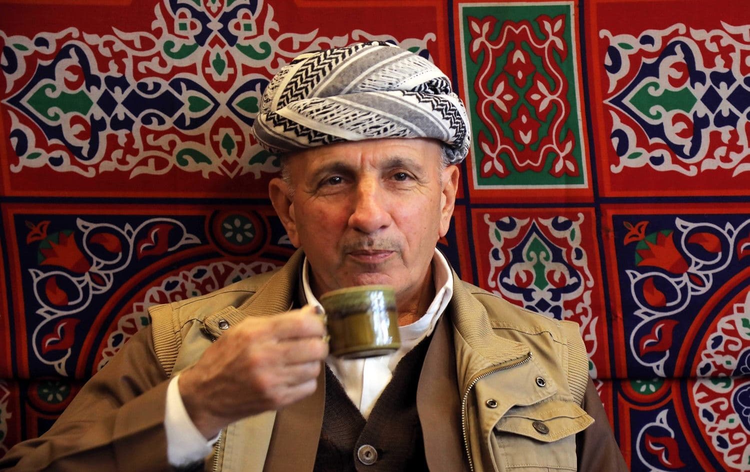 An Iraqi Kurdish man drinks Syrian coffee in Erbil's central bazar on December 21, 2019. Photo:Safin Hamed/AFP