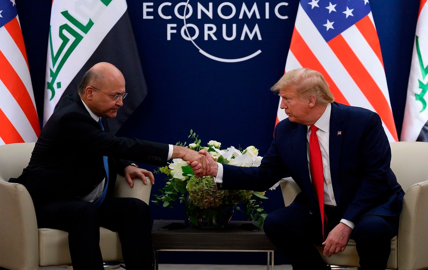 US President Donald Trump speaks with Iraqi President Barham Salih at the World Economic Forum in Davos, Switzerland, on January 22, 2020. Jim Watson/AFP