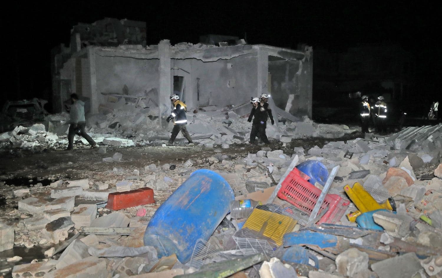 Members of the Syrian Civil Defence search for survivors and victims following a reported Russian air strike in the town of al-Fua, Idlib on March 2, 2020. Photo: Omar Haj Kadour/AFP