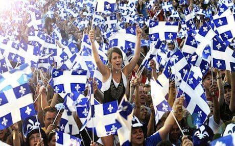 French-speaking residents of Quebec celebrating Quebec National Day. Photo: mtlblog.com