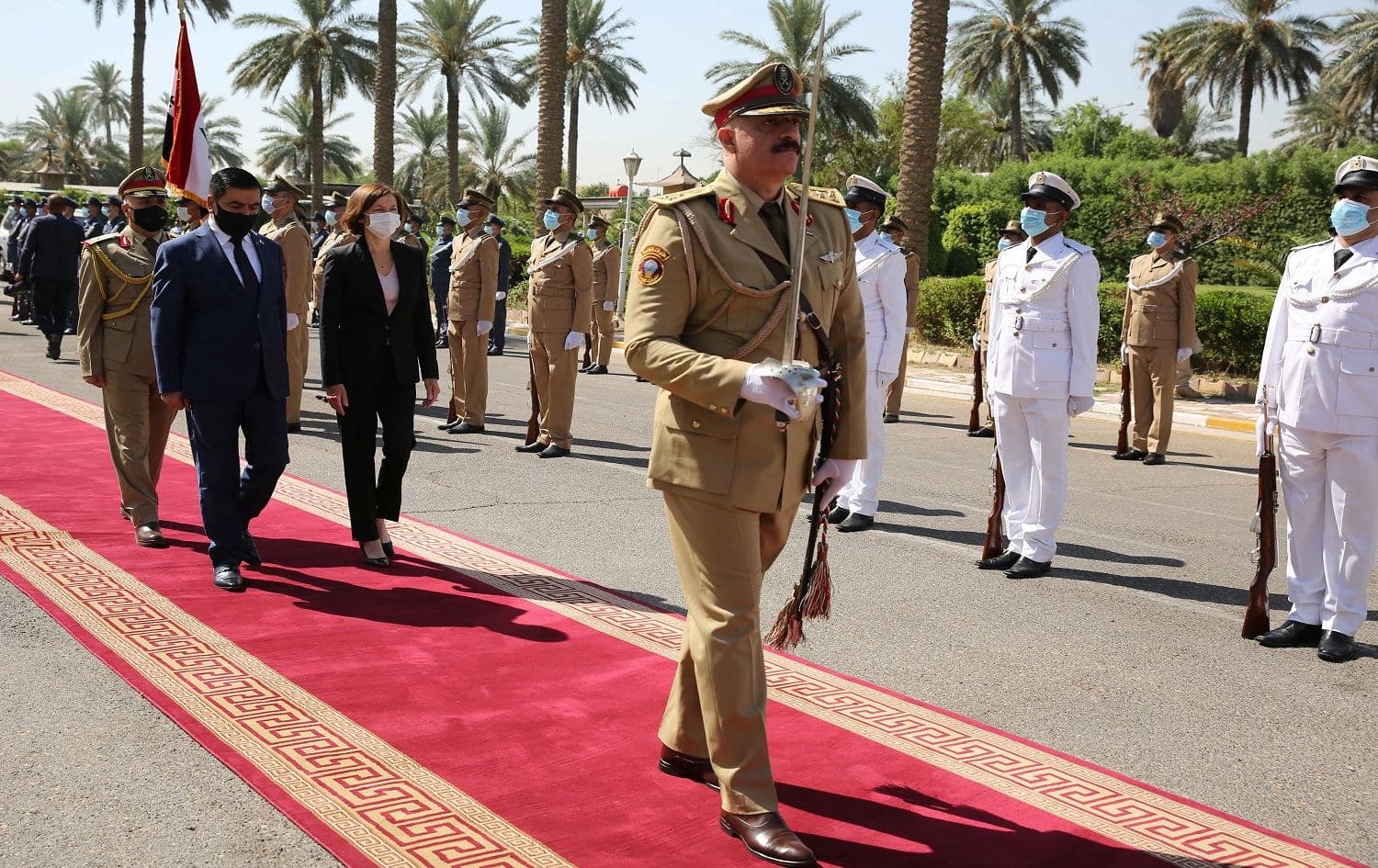 Iraqi Defense Minister Juma Inad (L) welcomes his French counterpart Florence Parly at the defence ministry in Baghdad's Green Zone area at the start of her official visit to Iraq on August 27, 2020. Photo: Ahmad al-Rubaye/AFP