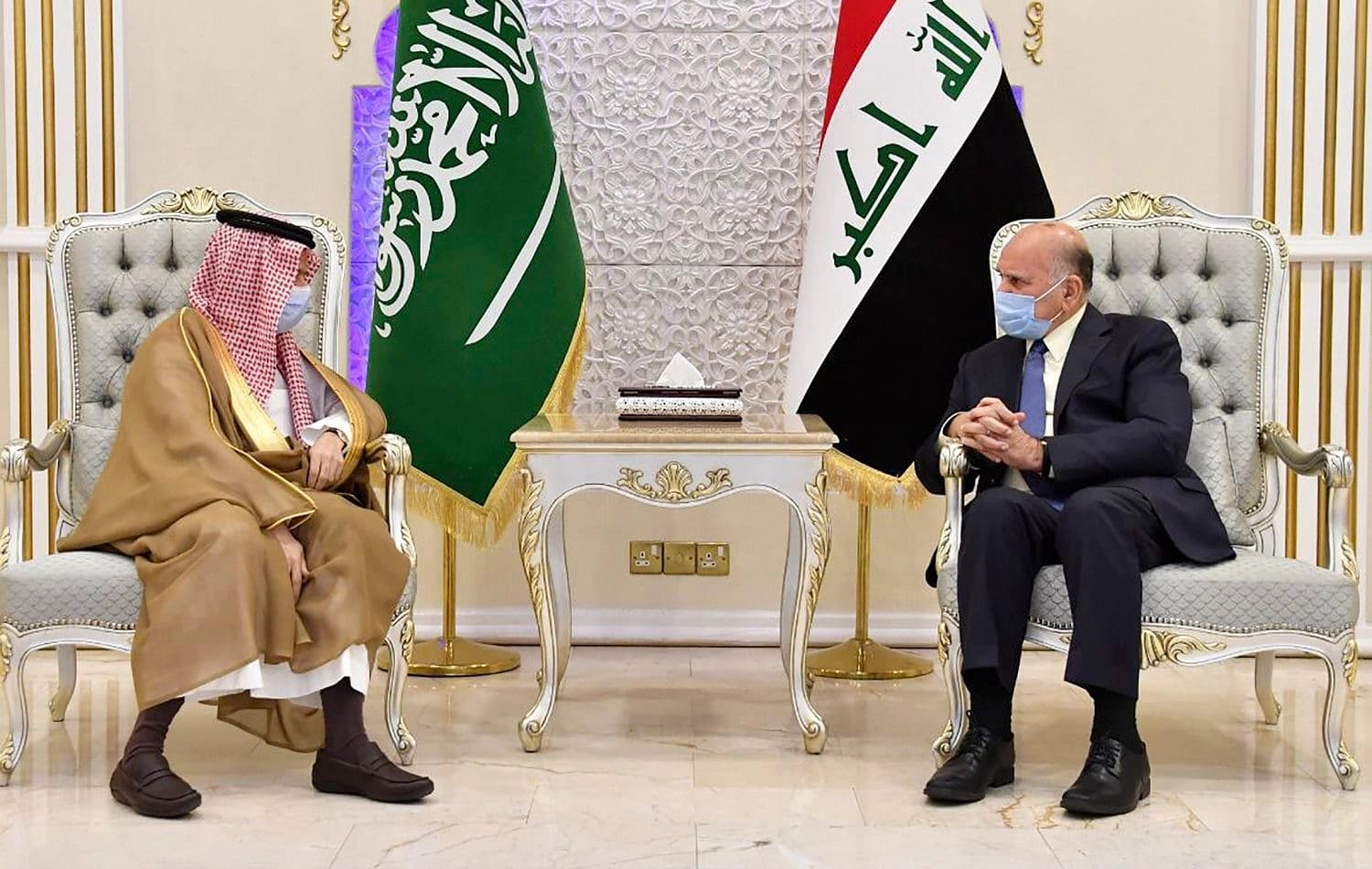 Iraq's foreign minister Fuad Hussein (right) receives his Saudi counterpart Prince Faisal bin Farhan al-Saud in Baghdad on August 27, 2020. Photo: Iraqi foreign ministry / AFP