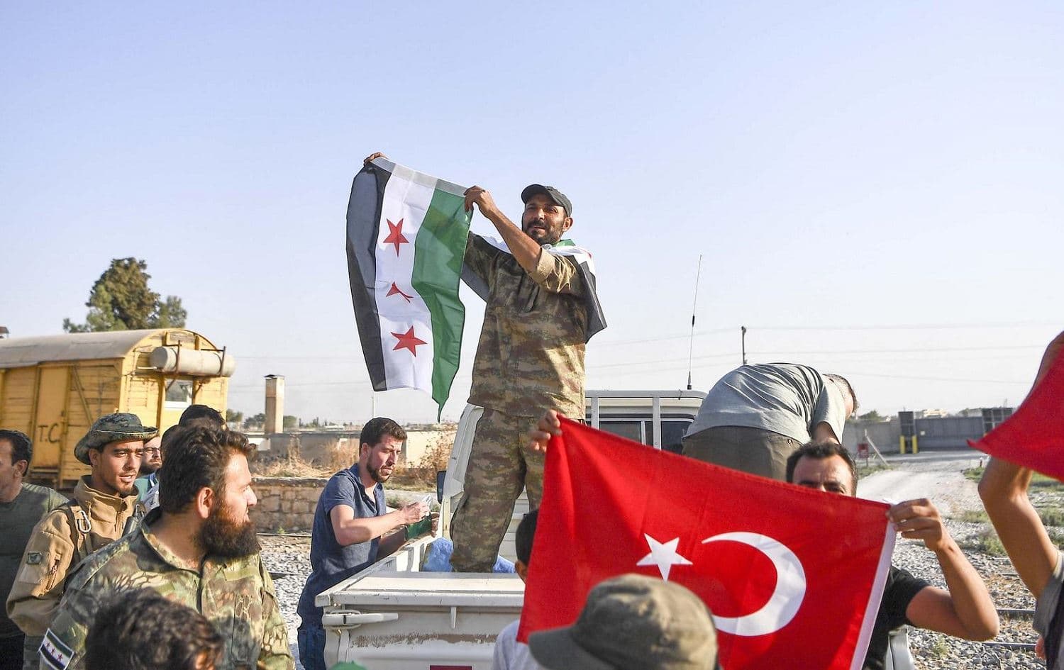 Fighters of the Turkish-backed Syrian National Army enter the town of Gire Spi (Tal Abyad). Photo: AP