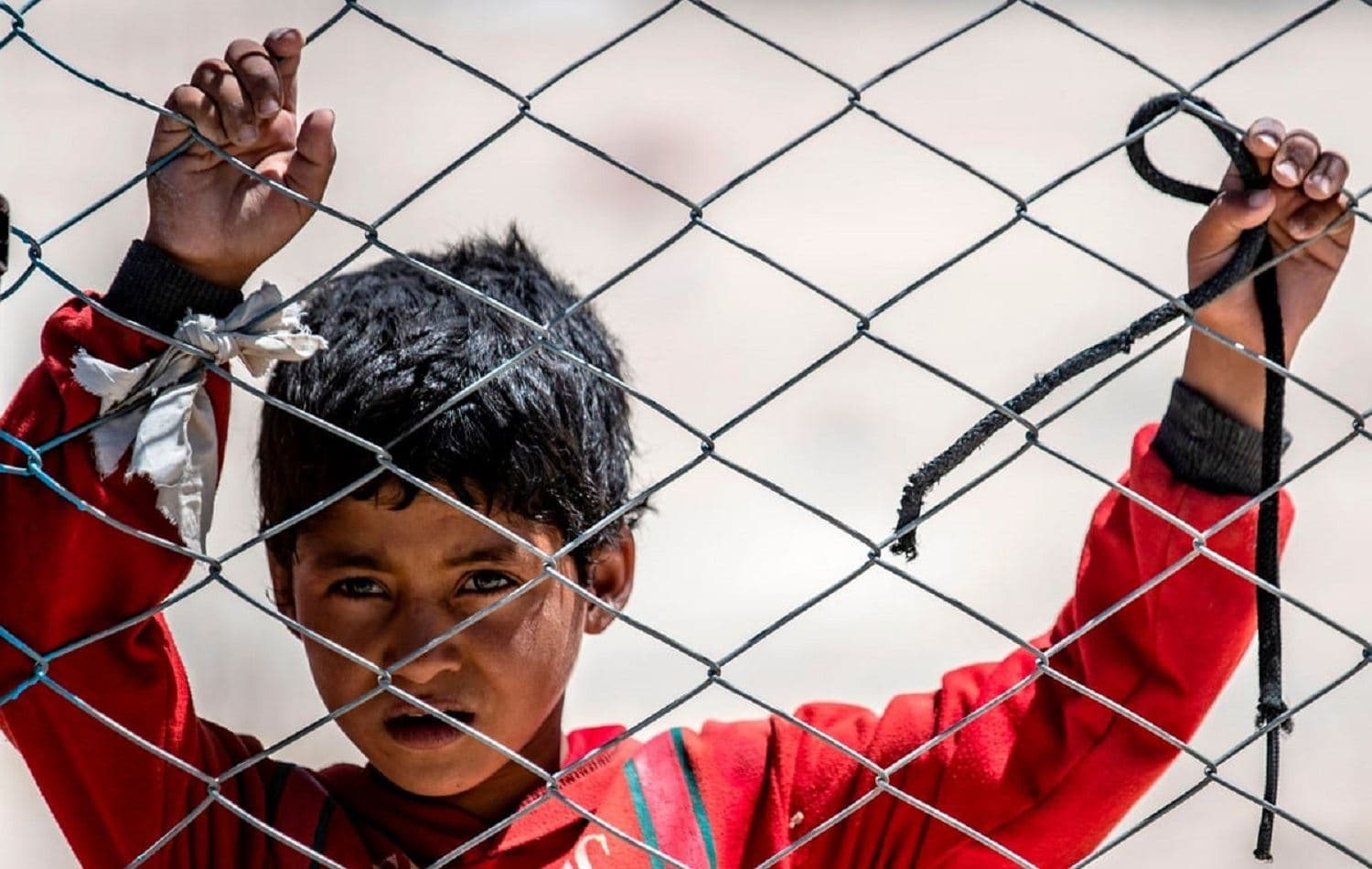A Syrian child looks on in al-Hol camp, northeastern Syria on 8 August 2019. File photo: Delil Souleiman/AFP