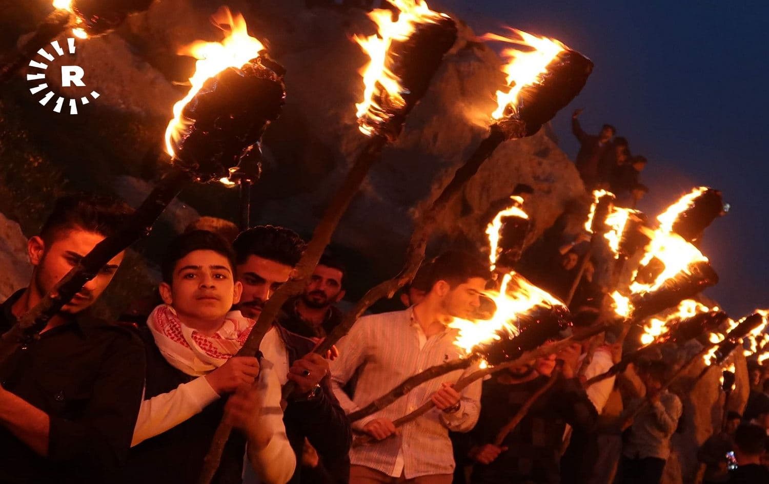 People carrying torches in Akre as part of the Newroz celebrations on March 20, 2019.Photo Bilind T. Abdullah/Rudaw
