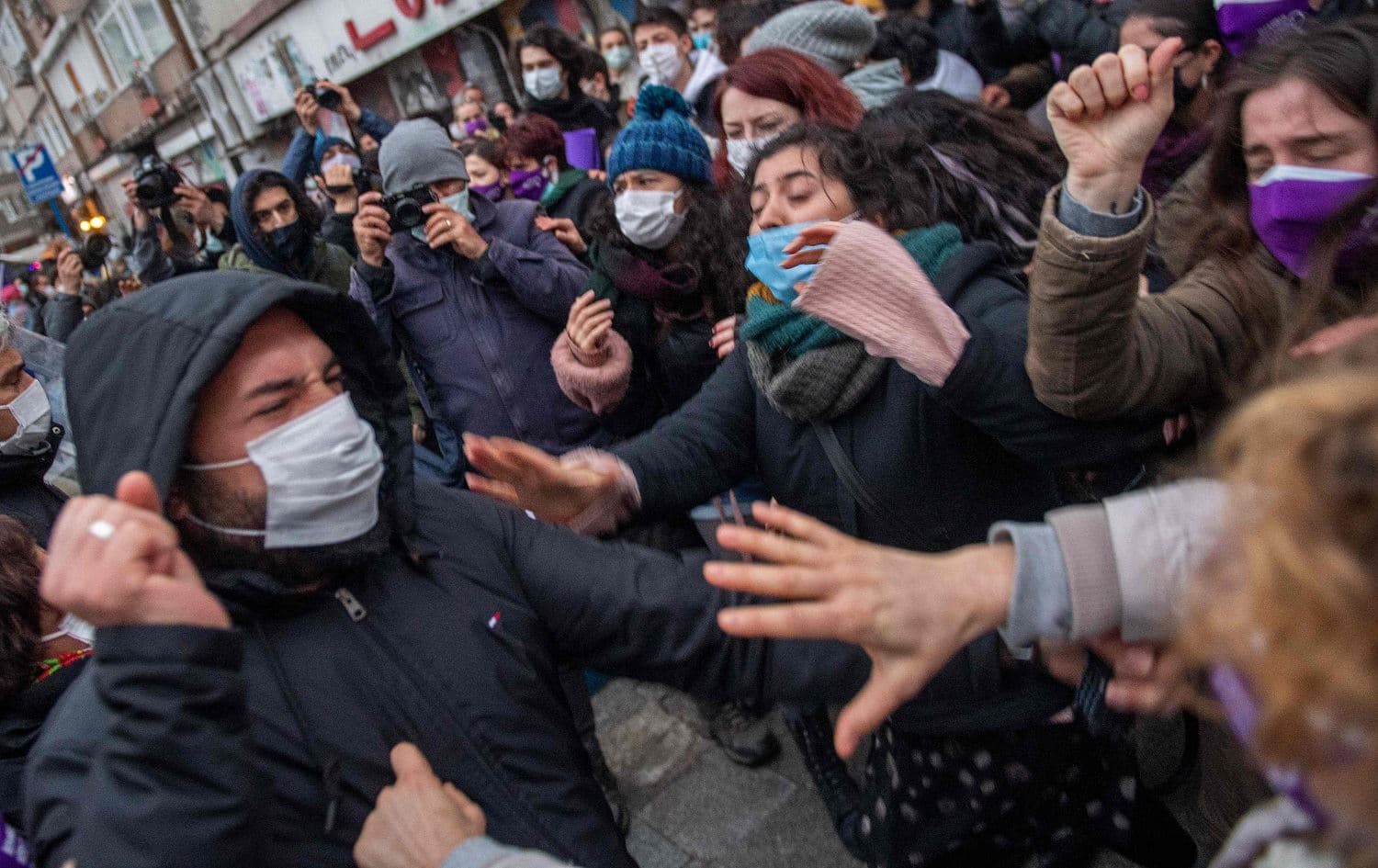 Protesters clash with a Turkish plain clothes police officer (left) during a demonstration against Turkey's withdrawal from Istanbul Convention in Istanbul on March 20, 2021. Photo: Bulent Kilic/AFP