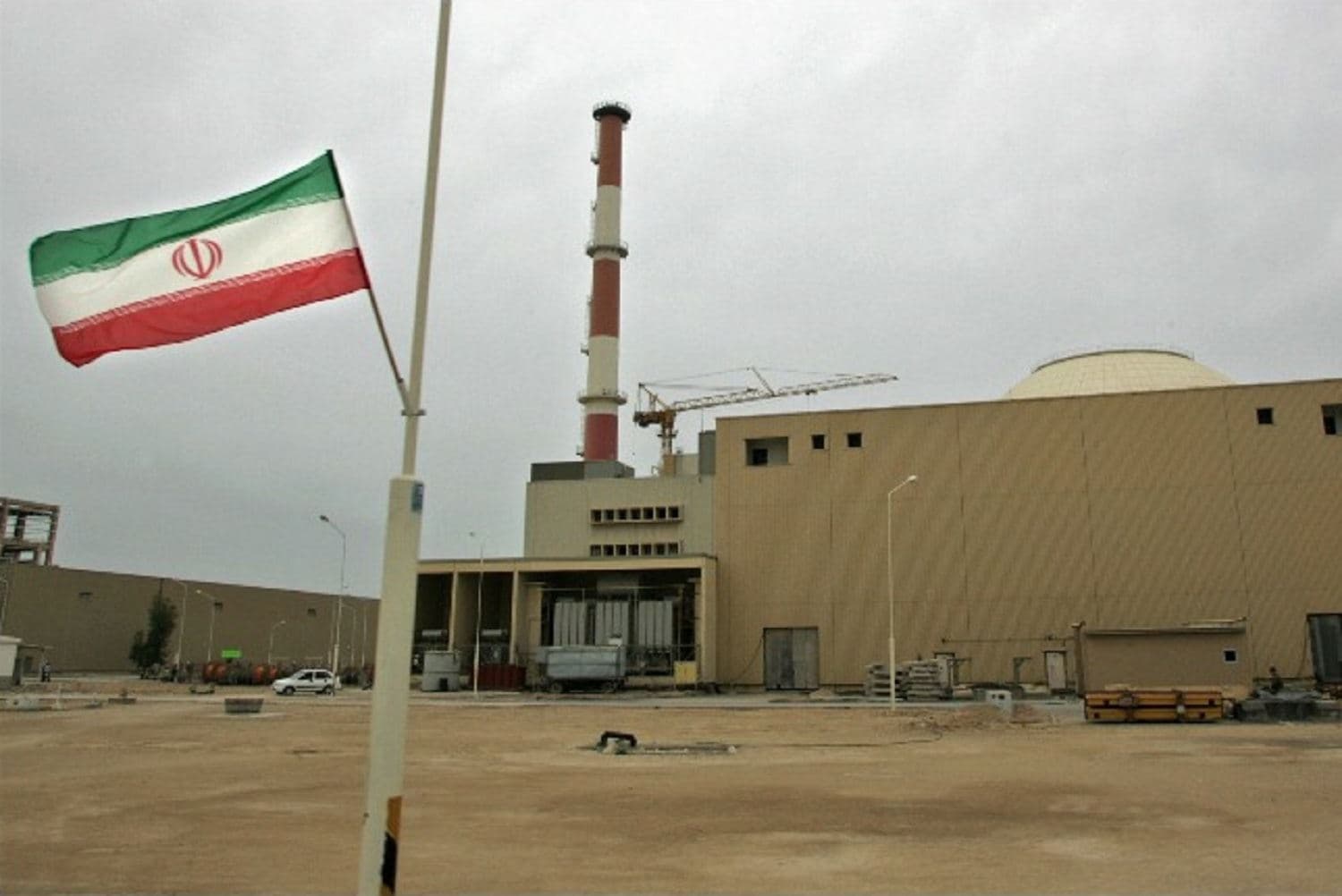 The Iranian flag is flown outside the Bushehr nuclear power plant. Photo: AFP/Berhouz Mehr