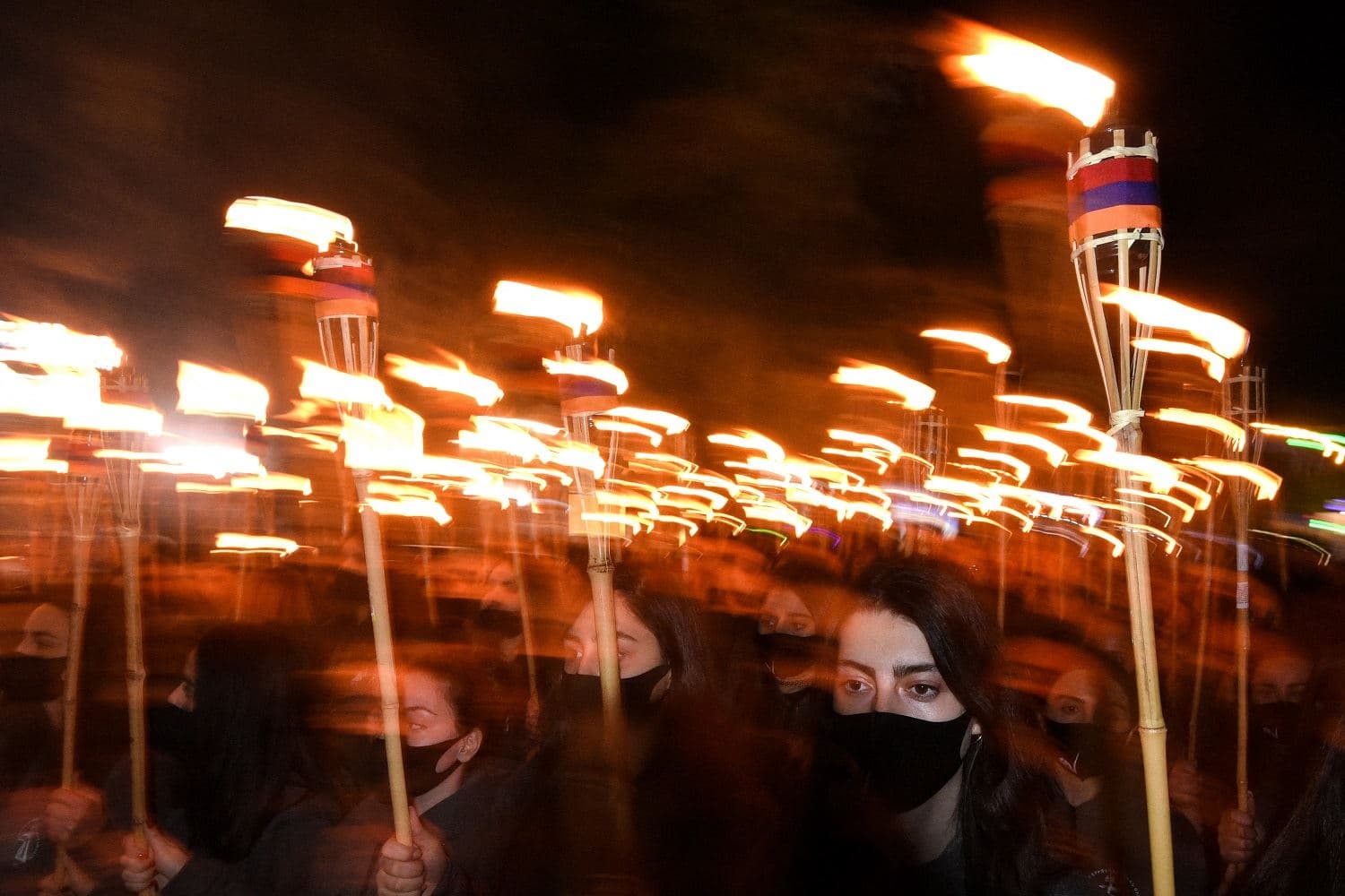 Armenians take part in a torchlight procession in Yerevan, late on April 23, 2021, to mark the 106th anniversary of World War I-era mass killings. Photo: Karen Minasyan / AFP
