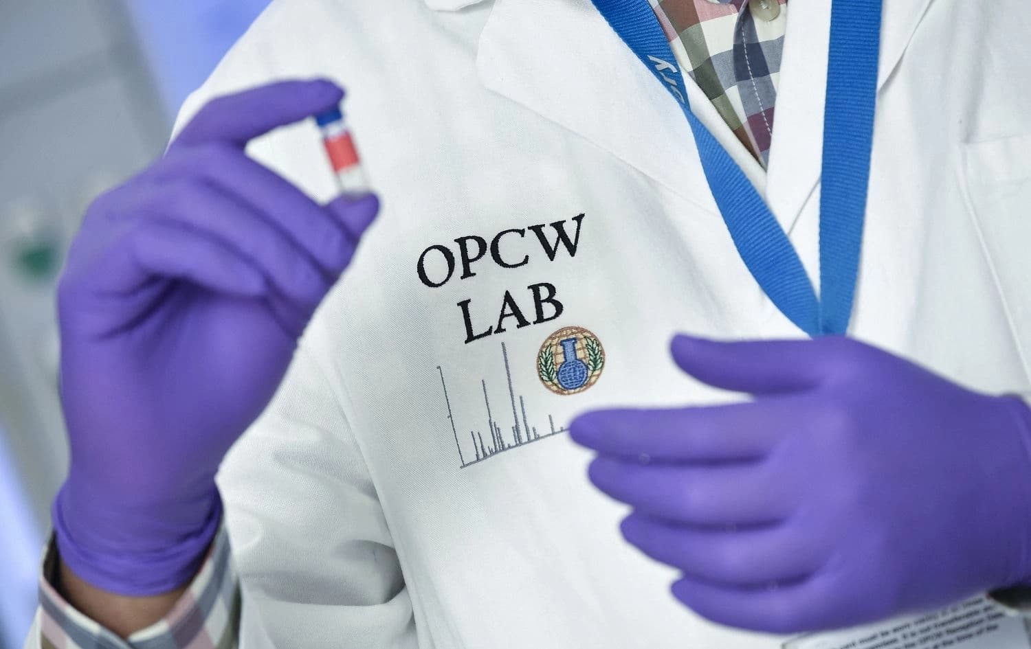 A laboratory technician controls a test vial at the OPCW (The Organisation for the Prohibition of Chemical Weapons) headquarters in the Hague on April 20, 2018. File photo: John Thys/AFP