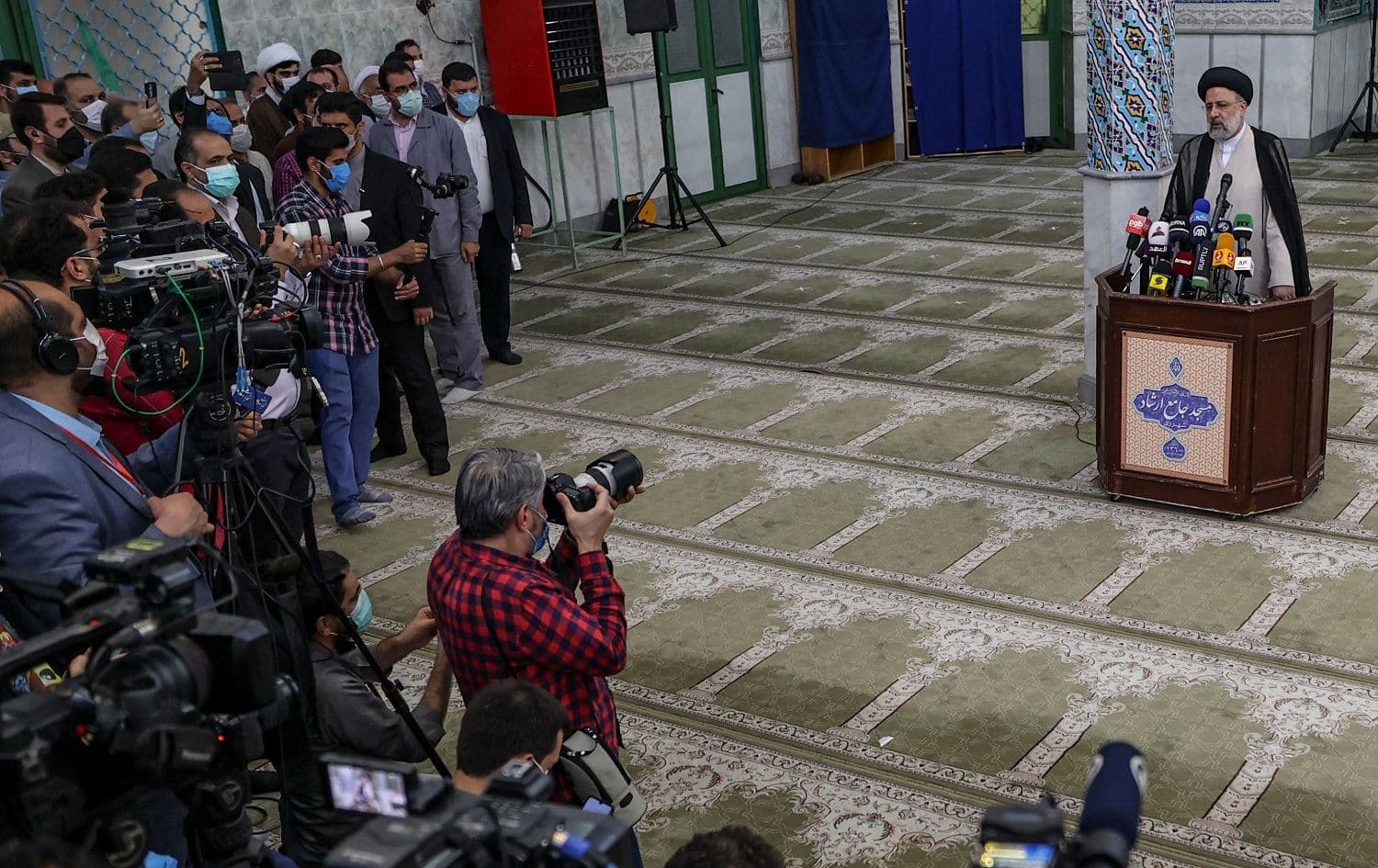 Iran's president-elect Ebrahim Raisi speaks to the press after voting in the presidential election in Tehran on June 18, 2021. Photo: Atta Kenare/AFP