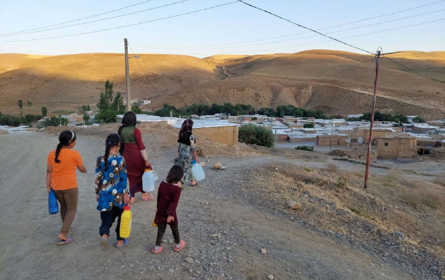 Women and children are providing drinking water for their families. Gulaneh village, Divandarreh. July 9, 2021. Photo: Jabar Dastbaz
