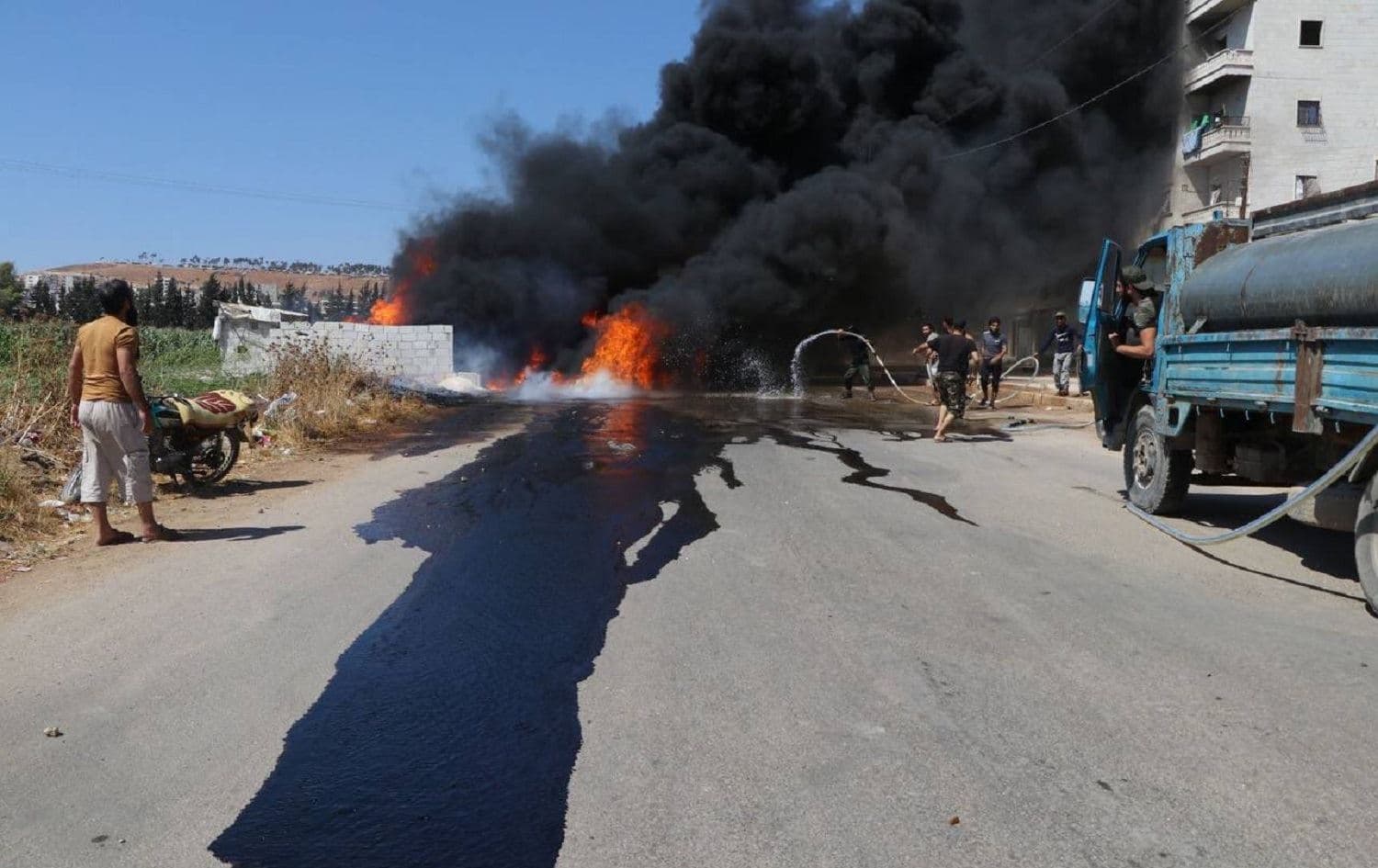 Thick, black smoke rises from the site of a deadly rocket attack on Afrin, Syria on August 18, 2021. Photo: handout/Turkey defence ministry
