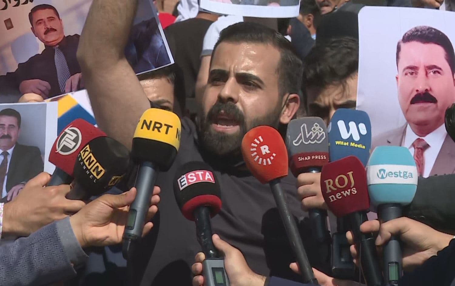 Ari Barwari speaks to media in front of an Erbil courthouse on September 15, 2021 after the trial of his father, teacher Badal Barwari, and journalist Omed Baroshki was postponed. Photo: Rudaw